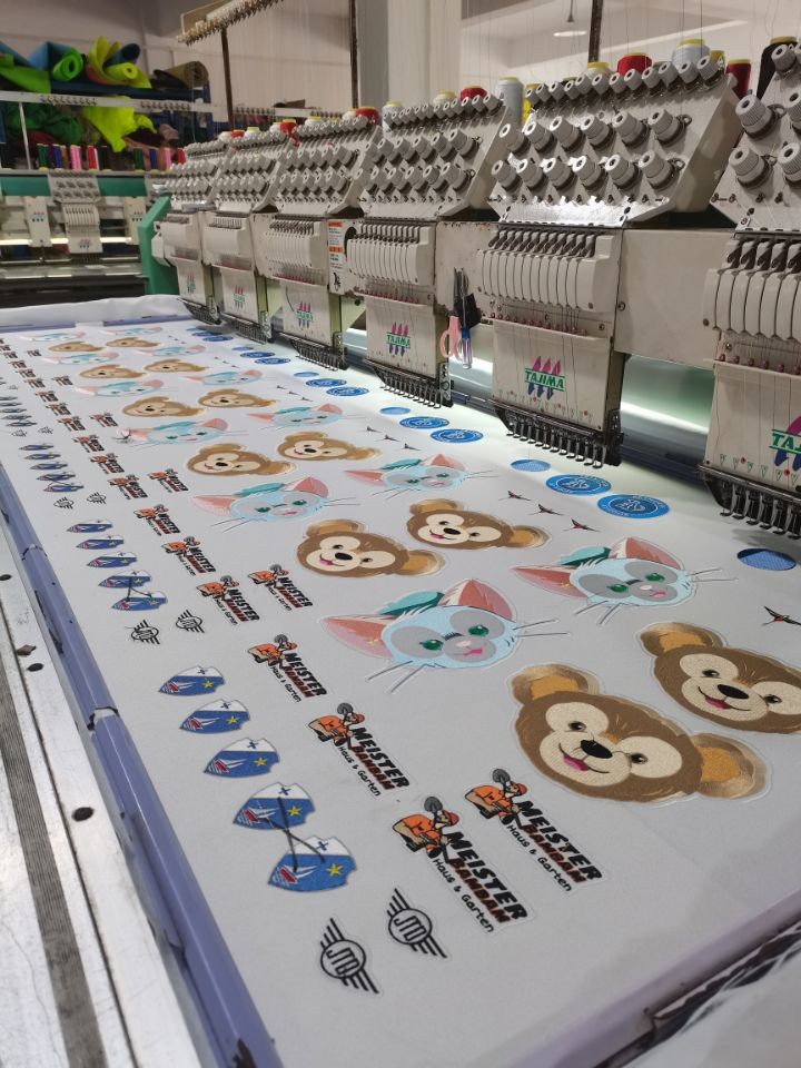 Embroidery machines stitching custom patches at RX Custom Patch Factory